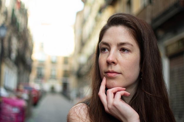 Portrait of attractive young woman gazing positively