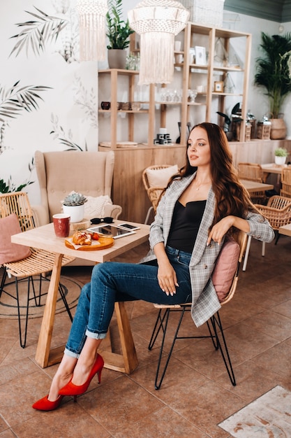 Portrait of an Attractive young woman who is sitting in a cafe