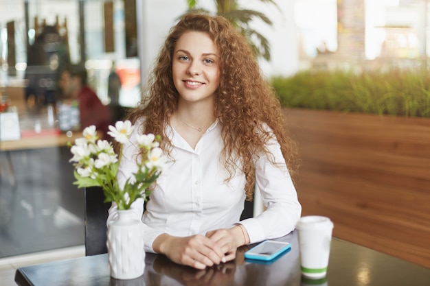 Portrait of attractive young woman with happy expression