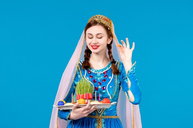 portrait of azeri woman in traditional dress with xonca blue wall spring dancers novruz ethnic