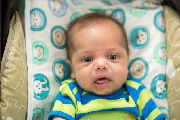 Portrait of baby in baby stroller