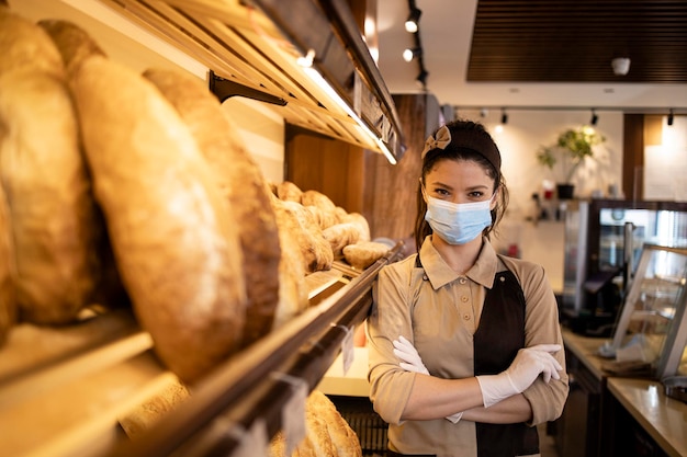 Portrait of bakery seller wearing face mask in supermarket