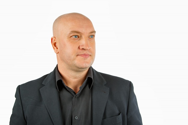 Portrait of a bald man in a black shirt and jacket on a white , businessman