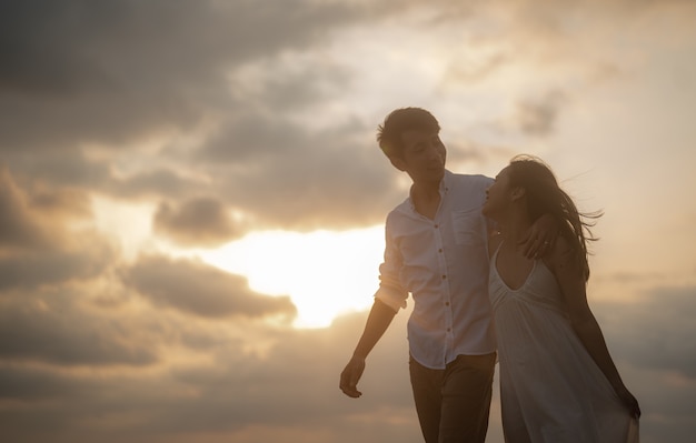 Portrait beach vacation romantic walk couple relaxing on ocean summer travel destinationY