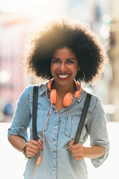 Portrait of beautiful afro american woman in the street.