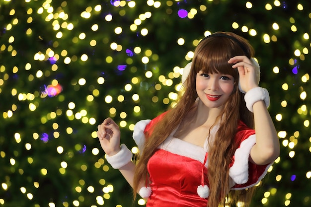 Portrait of beautiful Asian female santa in Christmas