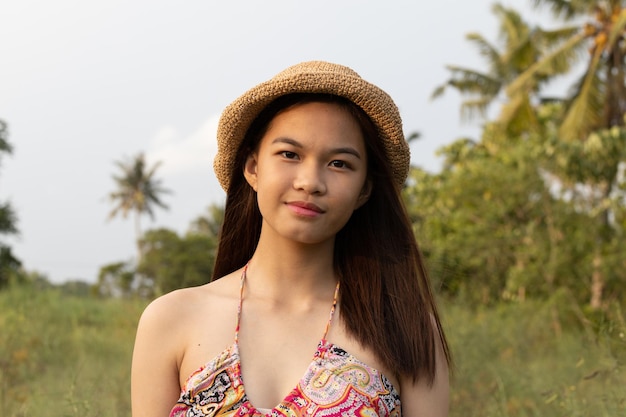 Photo portrait of a beautiful asian girl wearing a hat