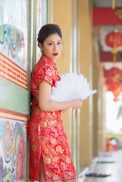 Portrait of beautiful asian woman in Cheongsam dressThailand peopleHappy Chinese new year concept