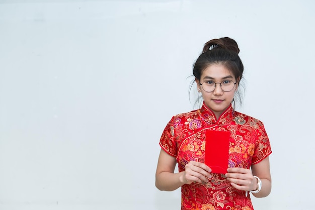 Portrait of beautiful asian woman in Cheongsam dressThailand peopleHappy Chinese new year concept