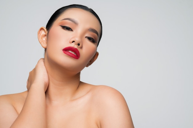 Portrait of beautiful asian woman with black hair and red lips