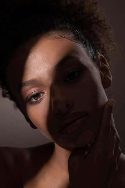 Portrait of beautiful black woman with mysterious shadows