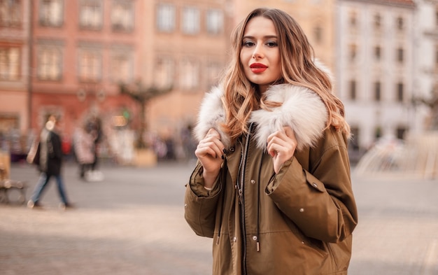 Portrait of beautiful blond woman dressed in warm clothes