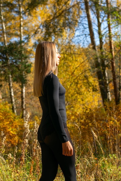 Portrait of a beautiful blonde in an autumn park