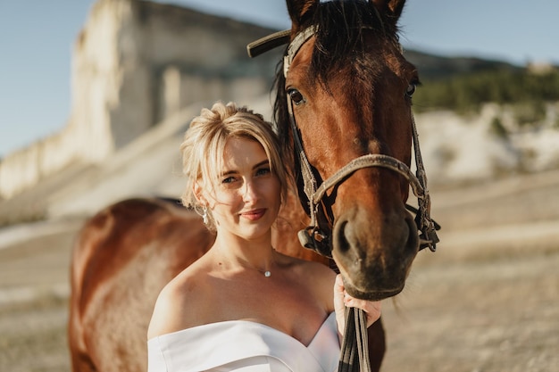 Portrait of a beautiful bride with horse