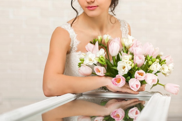 Portrait of beautiful bride with wedding bouquet