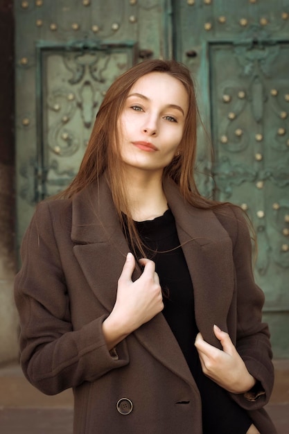 Portrait of beautiful brunette woman at the street