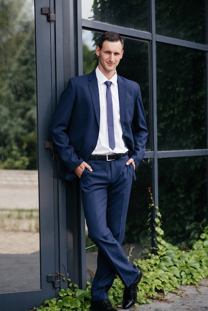 Portrait of a beautiful business man in a blue suit.