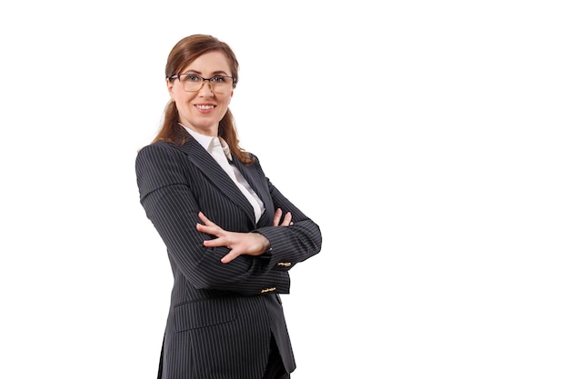 Portrait of a beautiful businesswoman 50 ears old in crossed arms pose isolated on white