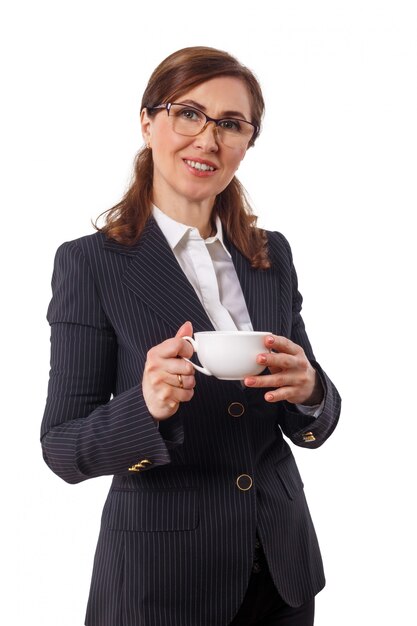 Portrait of a beautiful businesswoman 50 ears old with cup of coffee in the office.