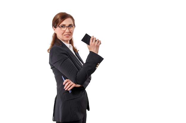 Portrait of a beautiful businesswoman 50 ears old with mobile phone isolated on white