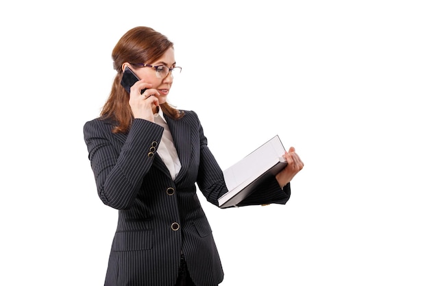 Portrait of a beautiful businesswoman 50 ears old with mobile phone isolated on white