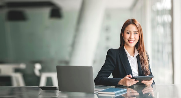 Portrait of beautiful businesswoman holding digital tablet