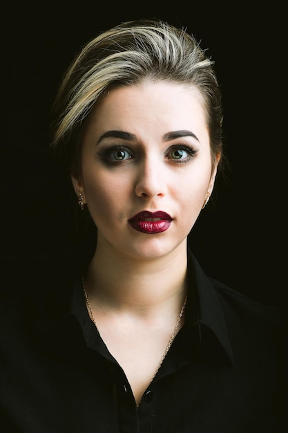 Portrait of a beautiful Caucasian girl with makeup and hairstyle