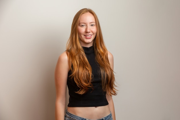 Portrait of beautiful cheerful redhead girl smiling laughing