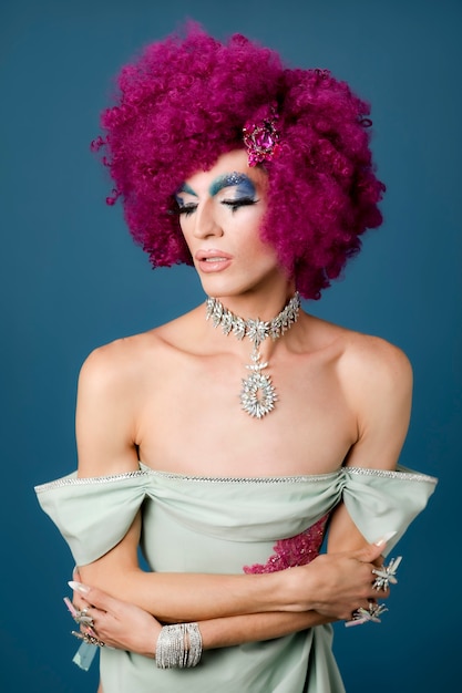 Photo portrait of beautiful drag person wearing makeup and wig