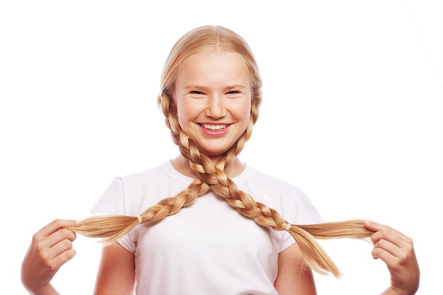 Portrait of a beautiful European blonde girl with braids