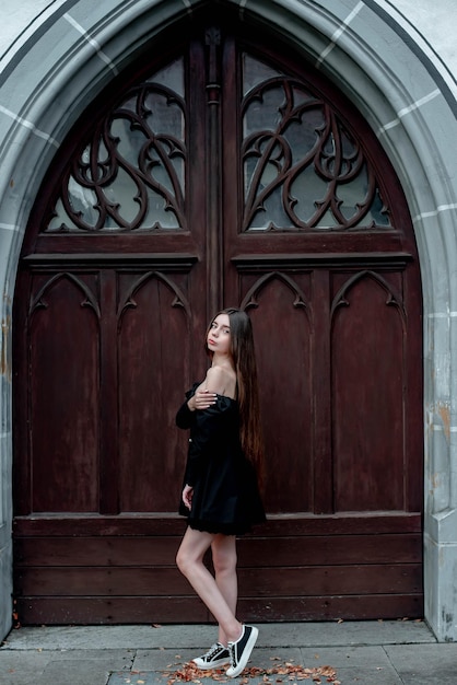 portrait of a beautiful girl on the background of beautiful doors