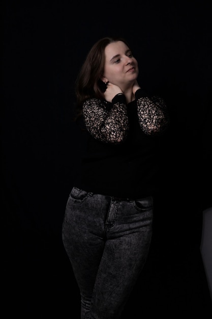 Portrait of a beautiful girl on a black background