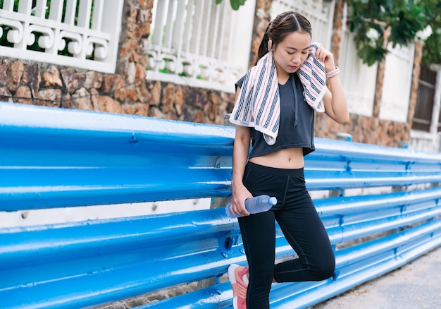 Portrait beautiful girl exercise jogging with tree background