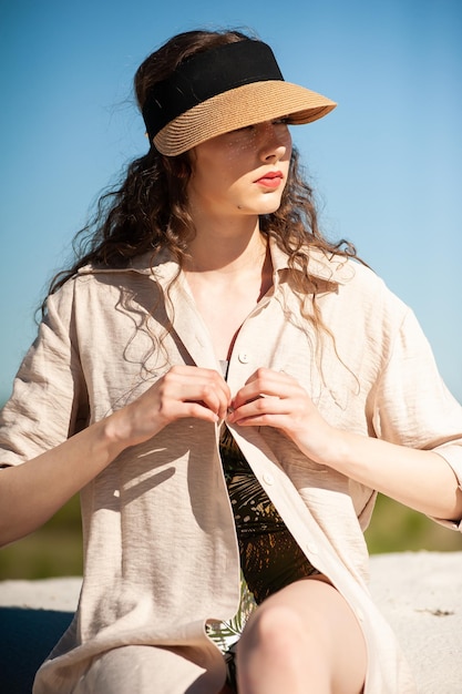 Portrait of beautiful girl model in casual summer clothes on nature background