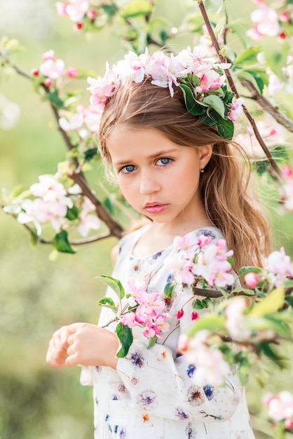 Portrait of a beautiful girl in a spring garden