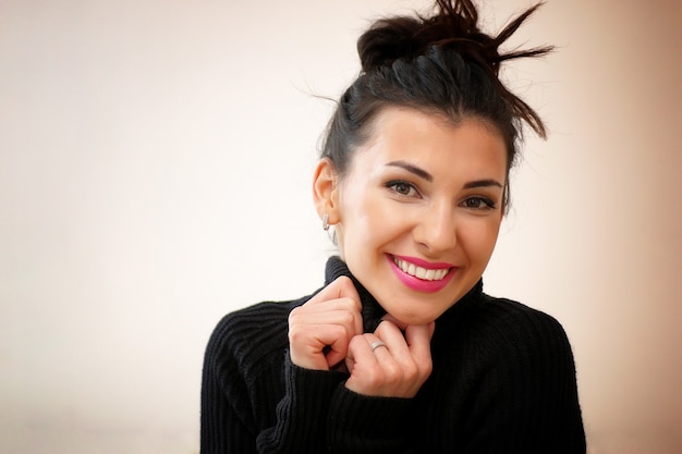 Portrait of beautiful girl with dark hair and vivid facial features