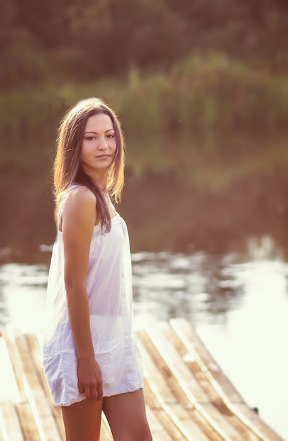 portrait of a beautiful girl with long hair in nature