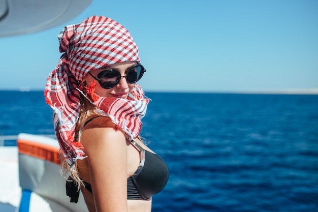 Portrait of a beautiful girl on a yacht