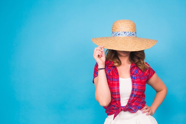 Portrait of a beautiful graceful woman in elegant hat with a wide brim. Beauty, fashion concept.