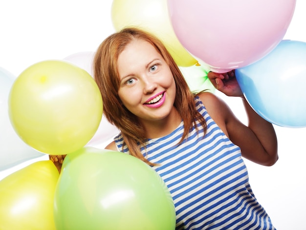 Portrait of beautiful happy girl with balloons