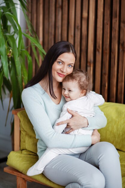 Portrait of a beautiful happy mom and little baby