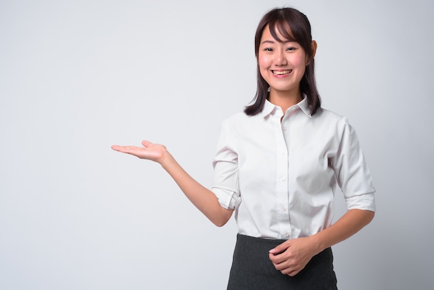 Portrait of beautiful Japanese businesswoman on white