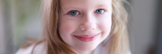 Portrait of beautiful little child girl with blue eyes