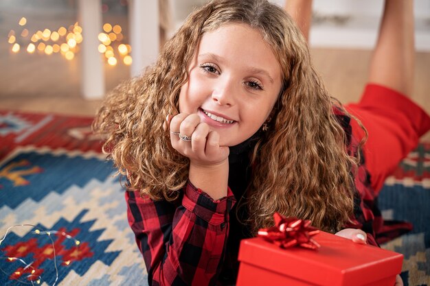 Portrait of a beautiful little girl in Christmas atmosphere