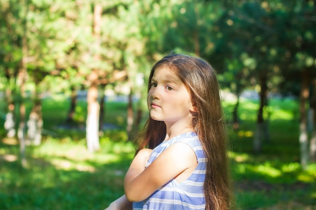 portrait of a beautiful little girl portrait of a pretty girl pretty little girl in the park