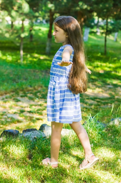 portrait of a beautiful little girl portrait of a pretty girl pretty little girl in the park