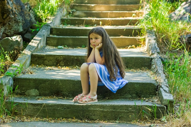 portrait of a beautiful little girl portrait of a pretty girl pretty little girl in the park