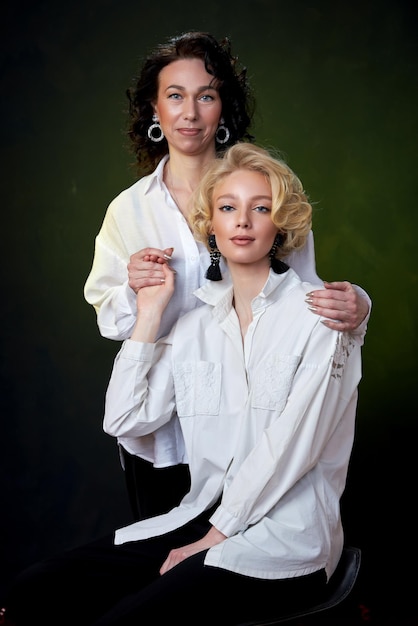 Portrait of beautiful mother daughter possing in a studio