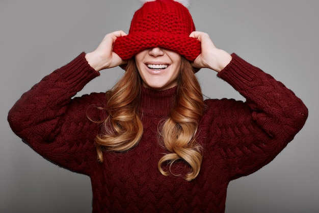 Portrait of beautiful redhead woman in sweater