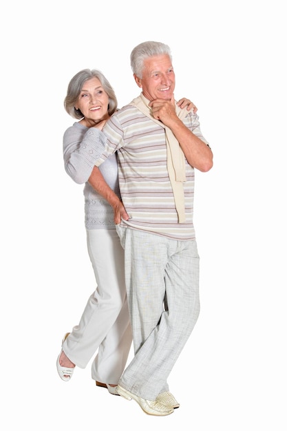 Portrait of beautiful senior couple posing on white background